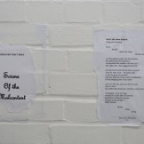 Dzekashu Macviban, poems from Scions of the Malcontent (2011), paper pasted on wall.